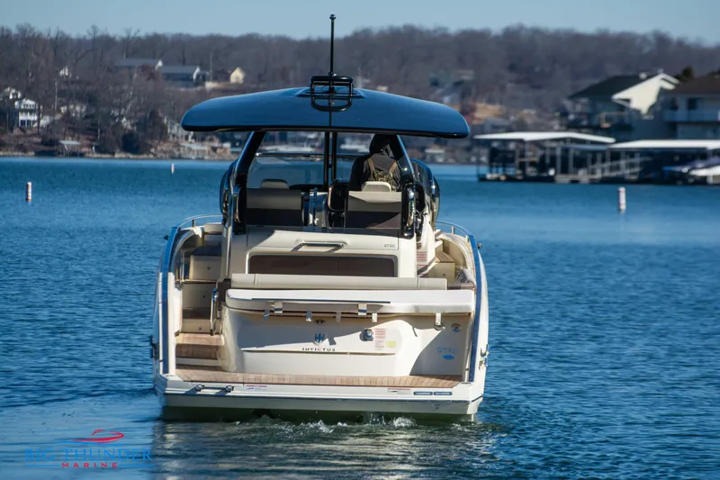 Slide: The Image of 2024 Invictus GT320 luxury motorboat cruising on a serene lake. - 10