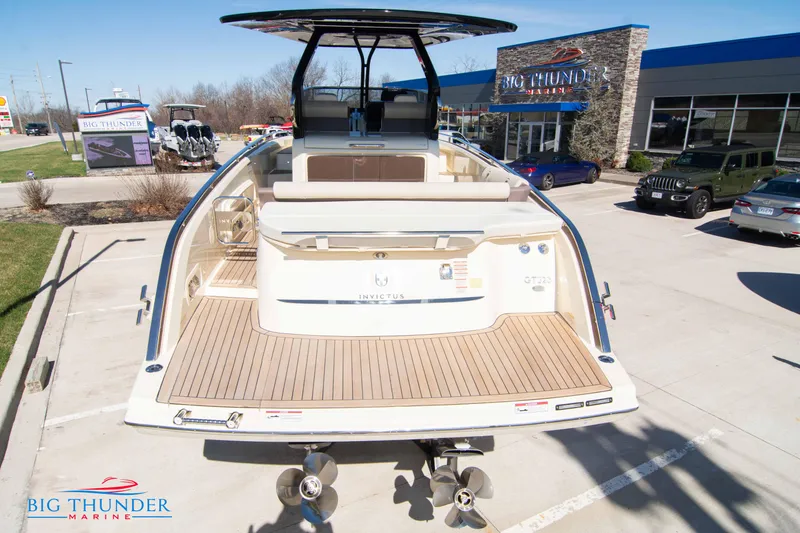Slide: The Image of 2024 Invictus GT320 luxury boat at Big Thunder Marine dealership. - 14