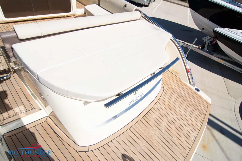 Slide: The Image of 2024 Invictus GT320 luxury yacht with teak deck and sunbed. - 18
