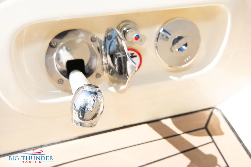 Slide: The Image of Close-up of 2024 Invictus GT320 boat fuel and water fill ports. - 21