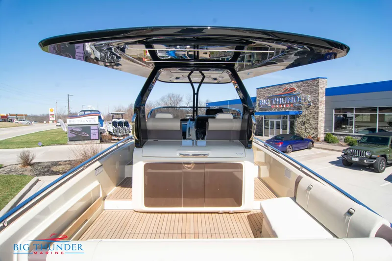 Slide: The Image of 2024 Invictus GT320 luxury boat at Big Thunder Marine dealership. - 22