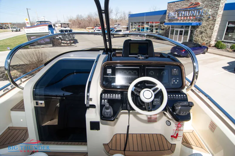 Slide: The Image of 2024 Invictus GT320 boat dashboard at Big Thunder Marine dealership. - 31