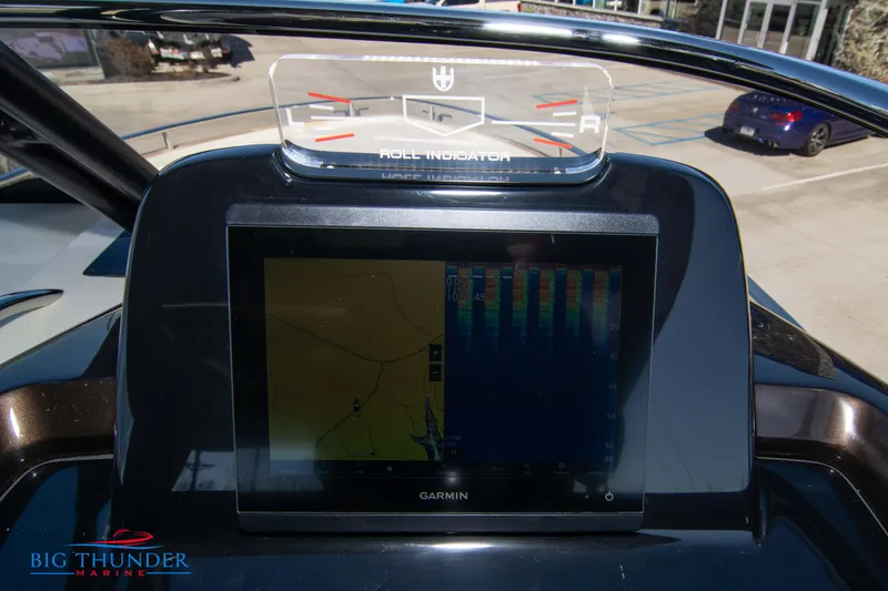 Slide: The Image of Dashboard of 2024 Invictus GT320 with Garmin navigation system. - 36