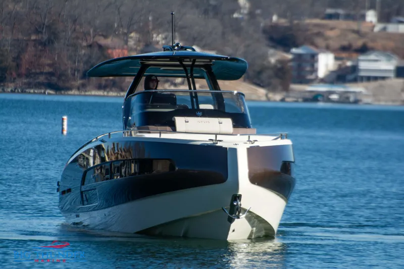 Slide: The Image of 2024 Invictus GT320 luxury yacht cruising on a serene lake. - 4