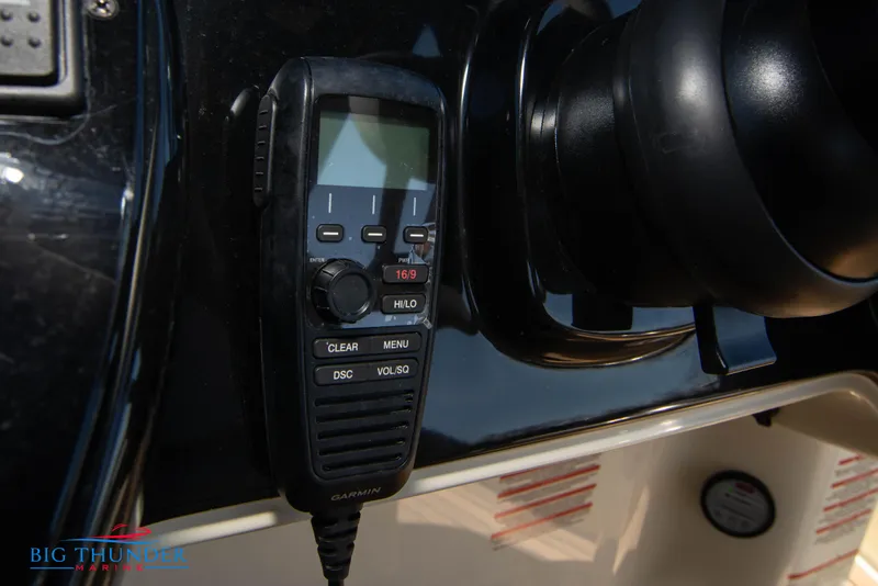 Slide: The Image of Close-up of a 2024 Invictus GT320 boat's communication radio system. - 42
