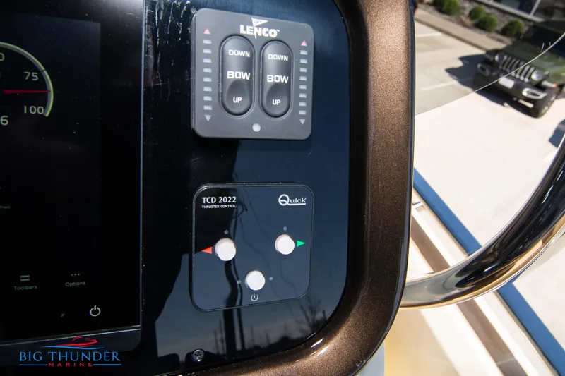 Slide: The Image of Control panel of a 2024 Invictus GT320 boat with Lenco and Quick systems. - 44