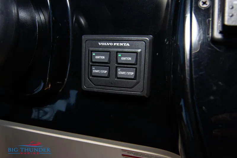 Slide: The Image of Control panel of a 2024 Invictus GT320 boat with Volvo Penta ignition buttons. - 45