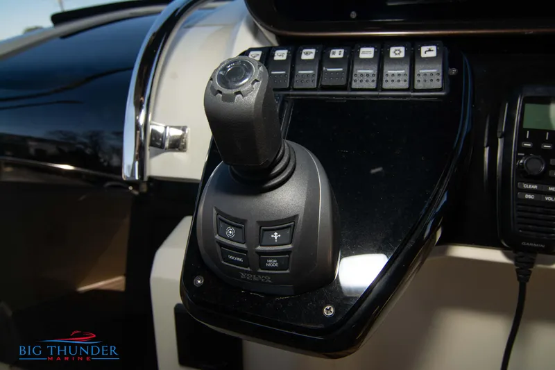 Slide: The Image of Control panel of the 2024 Invictus GT320 boat with joystick and switches. - 46