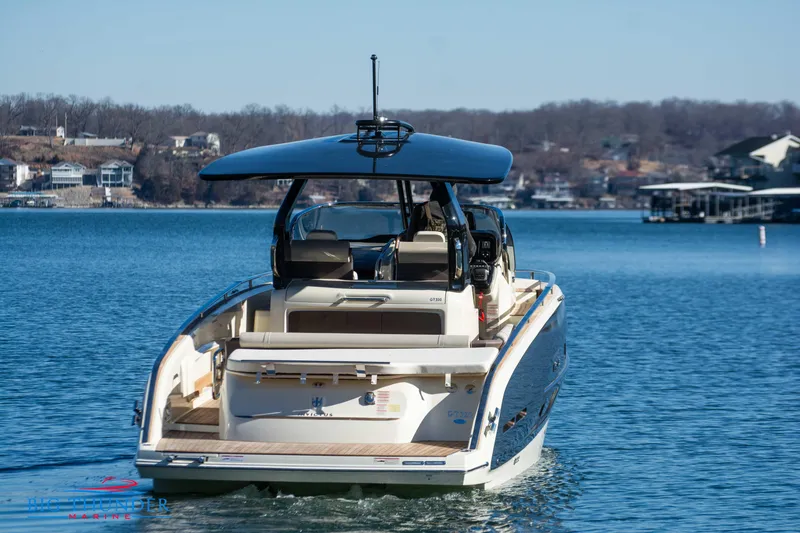 Slide: The Image of 2024 Invictus GT320 luxury yacht cruising on a serene lake. - 9