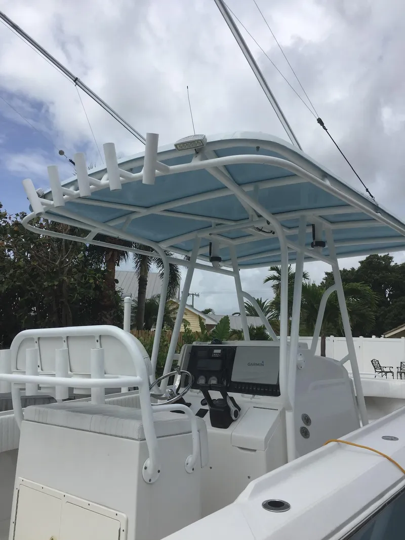 Slide: The Image of 2005 Jupiter FS boat with center console and T-top. - 3