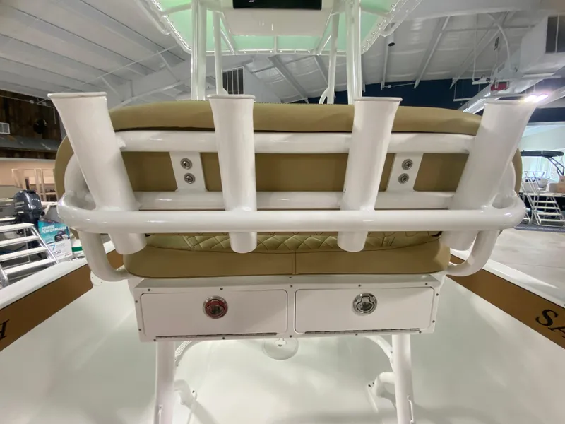 Slide: The Image of 2024 Savannah 210X boat interior with rod holders and storage compartments. - 8