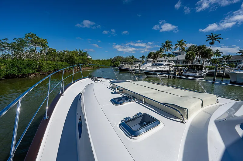 Slide: The Image of Bow view of 2011 Hunt Yachts 52 docked in a marina. - 11