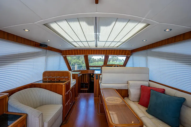 Slide: The Image of Luxurious interior of 2011 Hunt Yachts 52 with plush seating and panoramic windows. - 22