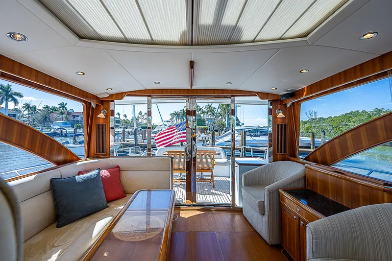 Slide: The Image of Luxurious interior of a 2011 Hunt Yachts 52, featuring elegant wood finishes and comfortable seating. - 23