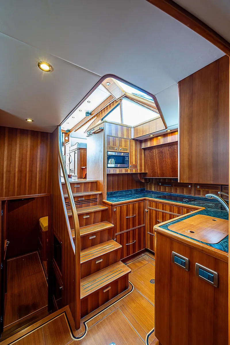 Slide: The Image of Luxurious 2011 Hunt Yachts 52 interior with wooden cabinetry and modern kitchen. - 29