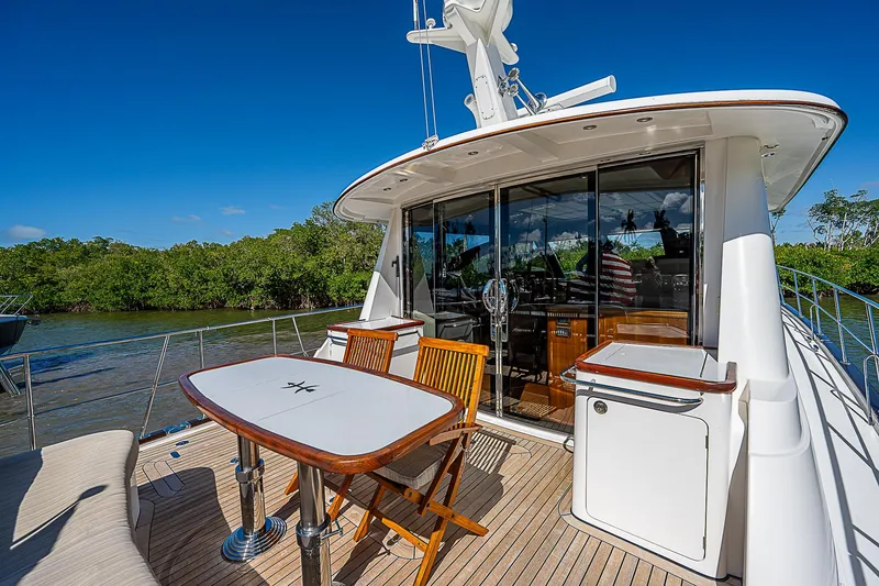 Slide: The Image of 2011 Hunt Yachts 52 aft deck with dining table and chairs. - 3