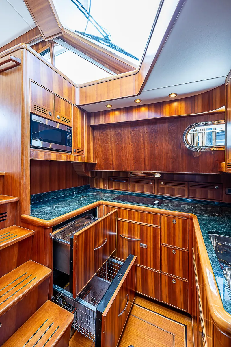 Slide: The Image of Luxurious kitchen area in 2011 Hunt Yachts 52 with wooden cabinetry and modern appliances. - 31