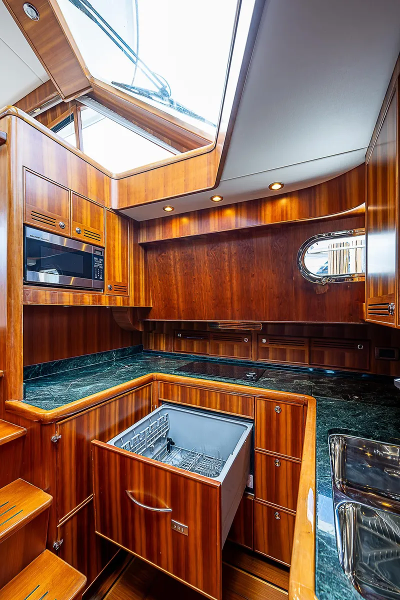 Slide: The Image of Luxurious kitchen area in 2011 Hunt Yachts 52 with wood cabinetry and modern appliances. - 32
