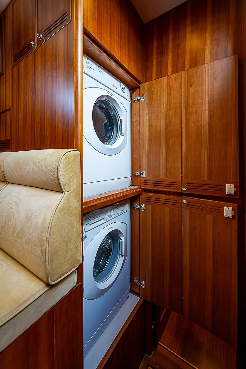Slide: The Image of Laundry area with stacked washer and dryer in 2011 Hunt Yachts 52. - 38