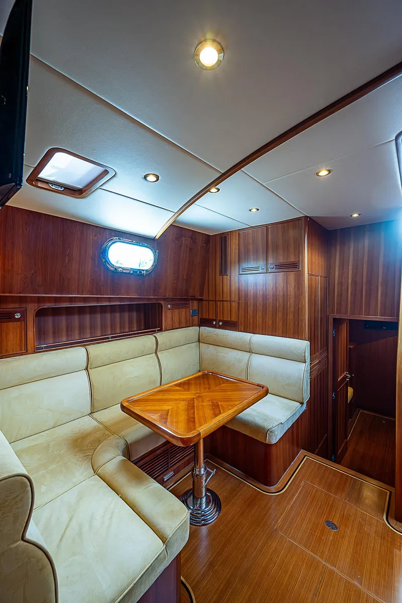Slide: The Image of Luxurious interior of 2011 Hunt Yachts 52 with wooden finishes and cozy seating area. - 4