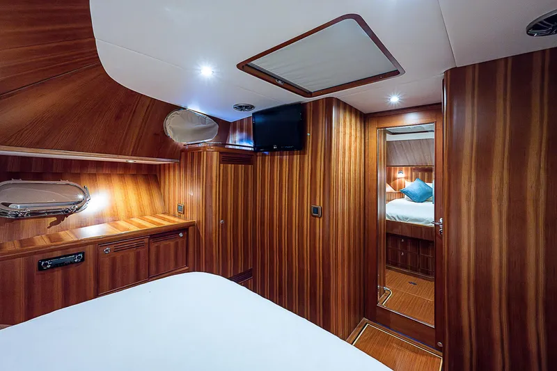 Slide: The Image of Luxurious wooden interior of 2011 Hunt Yachts 52 cabin with bed and TV. - 40