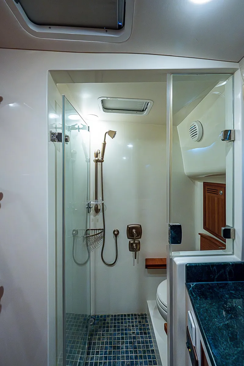 Slide: The Image of 2011 Hunt Yachts 52 model bathroom with glass shower and modern fixtures. - 41