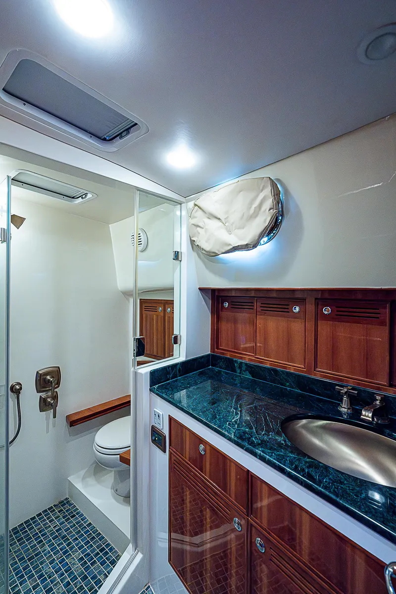 Slide: The Image of Luxurious bathroom in 2011 Hunt Yachts 52 with glass shower and marble countertop. - 43