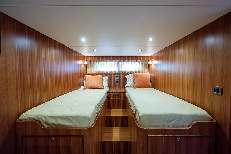 Slide: The Image of Twin beds in the 2011 Hunt Yachts 52 cabin with wooden interior. - 44