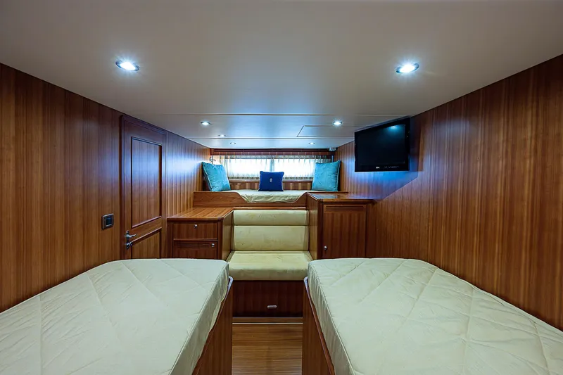 Slide: The Image of Luxurious cabin interior of 2011 Hunt Yachts 52 with twin beds and TV. - 47