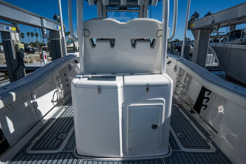 Slide: The Image of 2022 Tidewater 292CC Adventure boat interior with storage compartments and seating. - 19