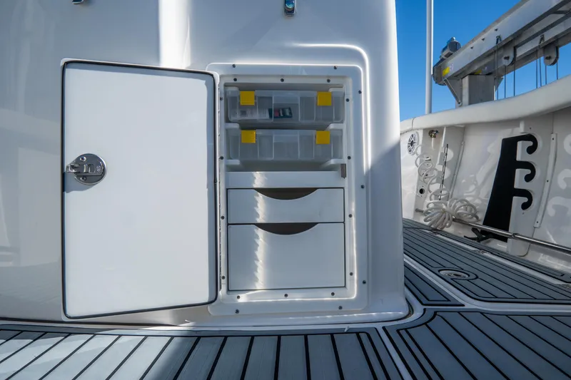 Slide: The Image of Storage compartment on the 2022 Tidewater 292CC Adventure boat. - 22