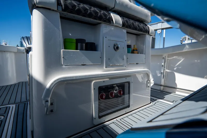 Slide: The Image of 2022 Tidewater 292CC Adventure boat interior with storage compartments and seating. - 29