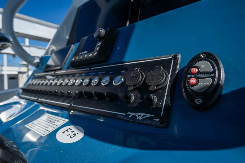 Slide: The Image of Control panel of 2022 Tidewater 292CC Adventure boat, featuring switches and buttons. - 33