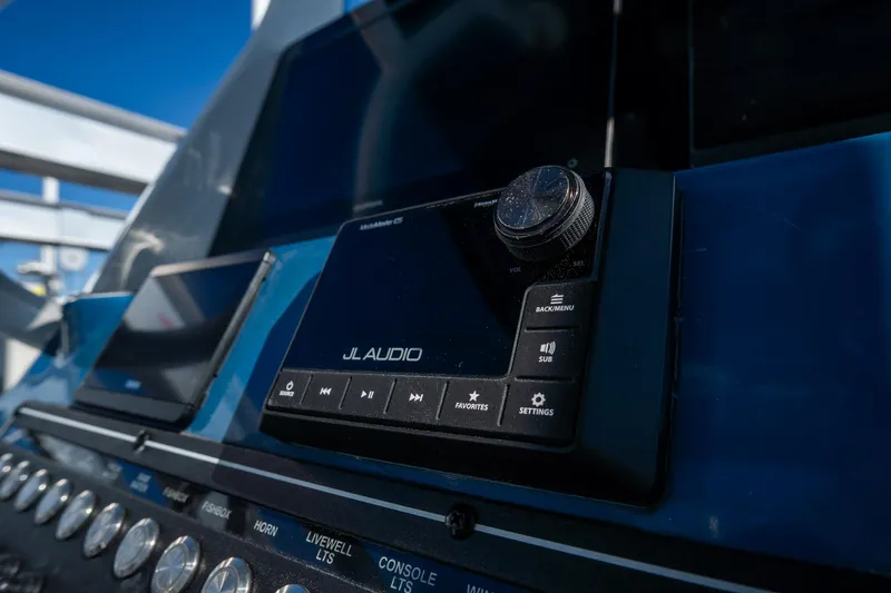 Slide: The Image of Control panel of 2022 Tidewater 292CC Adventure boat featuring JL Audio system. - 34