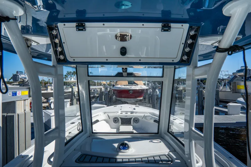 Slide: The Image of 2022 Tidewater 292CC Adventure boat interior view at marina. - 35