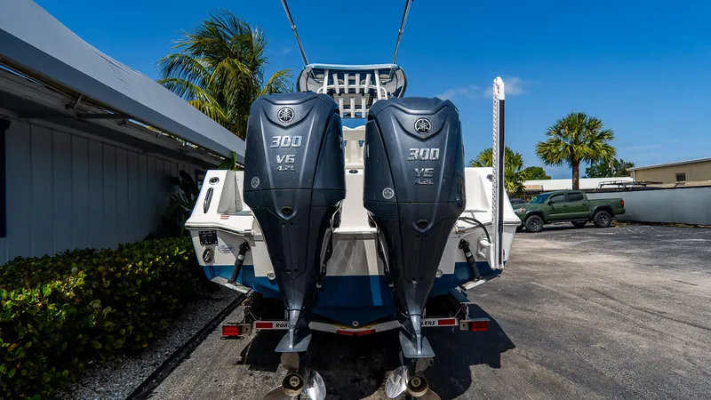 Slide: The Image of 2022 Tidewater 292CC Adventure boat with dual 300 V6 engines, parked outdoors. - 4