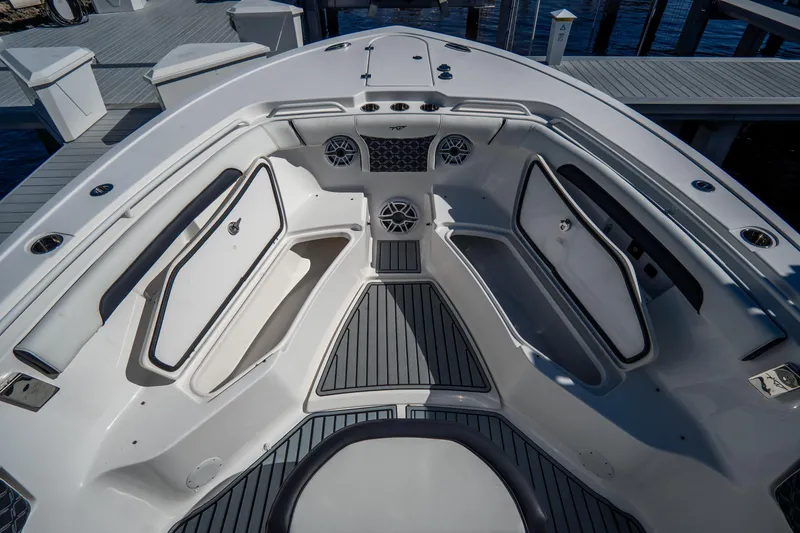 Slide: The Image of 2022 Tidewater 292CC Adventure boat interior with spacious seating and storage compartments. - 40