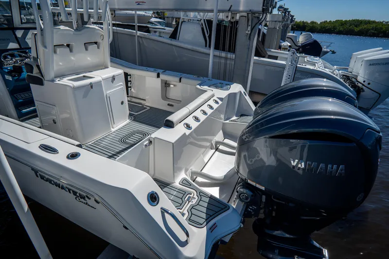 Slide: The Image of 2022 Tidewater 292CC Adventure boat with Yamaha engines docked. - 6