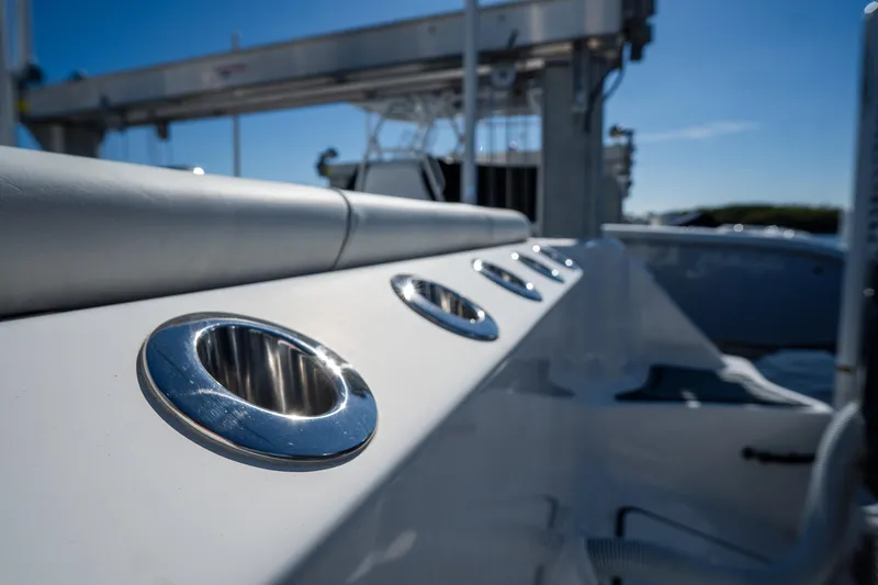 Slide: The Image of Close-up of 2022 Tidewater 292CC Adventure boat rod holders. - 8