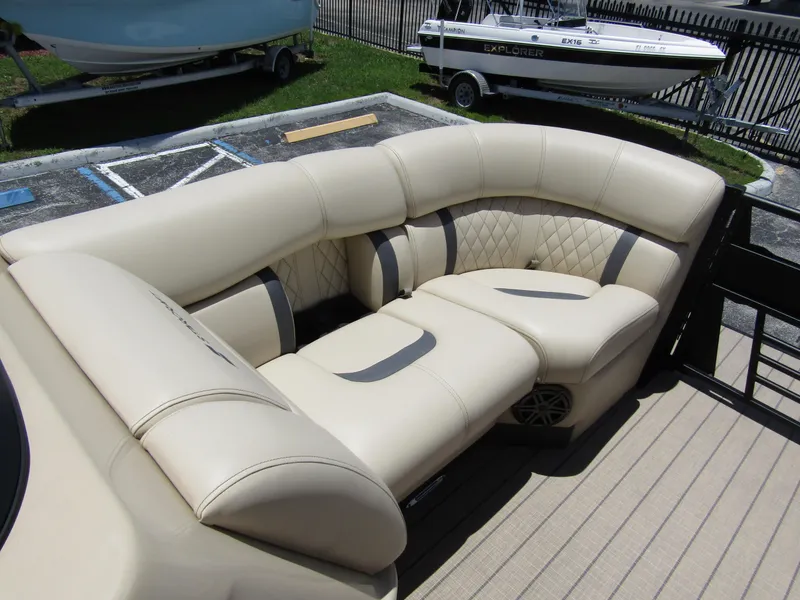 Slide: The Image of 2024 Starcraft RX 23 Q DC boat with luxurious beige seating. - 10