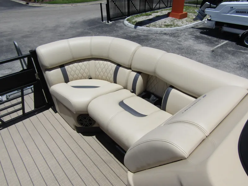 Slide: The Image of 2024 Starcraft RX 23 Q DC boat with beige leather seating. - 11