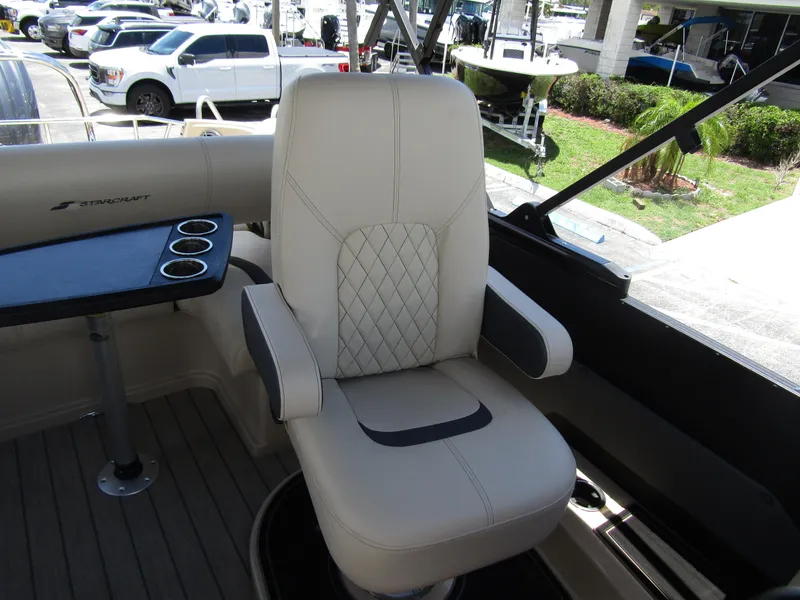 Slide: The Image of 2024 Starcraft RX 23 Q DC boat captain's chair with cup holders. - 14