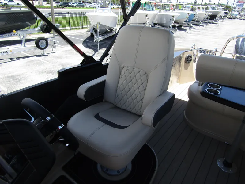 Slide: The Image of Captain's chair in 2024 Starcraft RX 23 Q DC boat, featuring luxurious design and comfortable seating. - 15