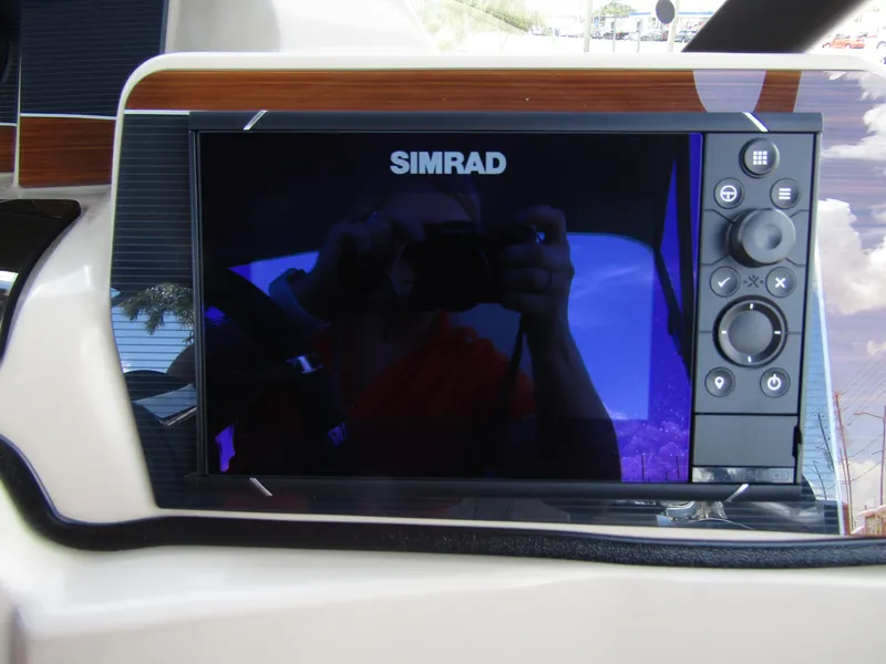 Slide: The Image of Simrad navigation system on 2024 Starcraft RX 23 Q DC boat dashboard. - 20