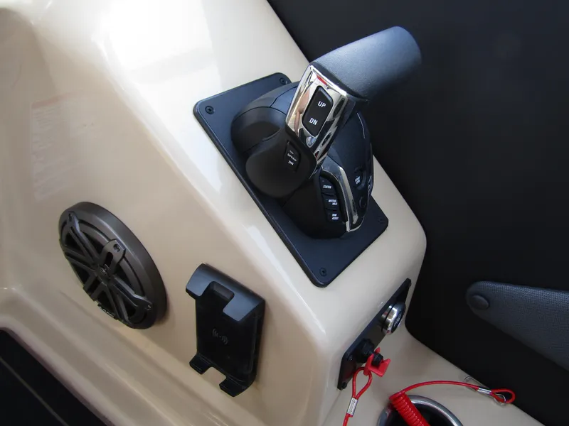 Slide: The Image of 2024 Starcraft RX 23 Q DC boat control panel with throttle and speaker. - 21