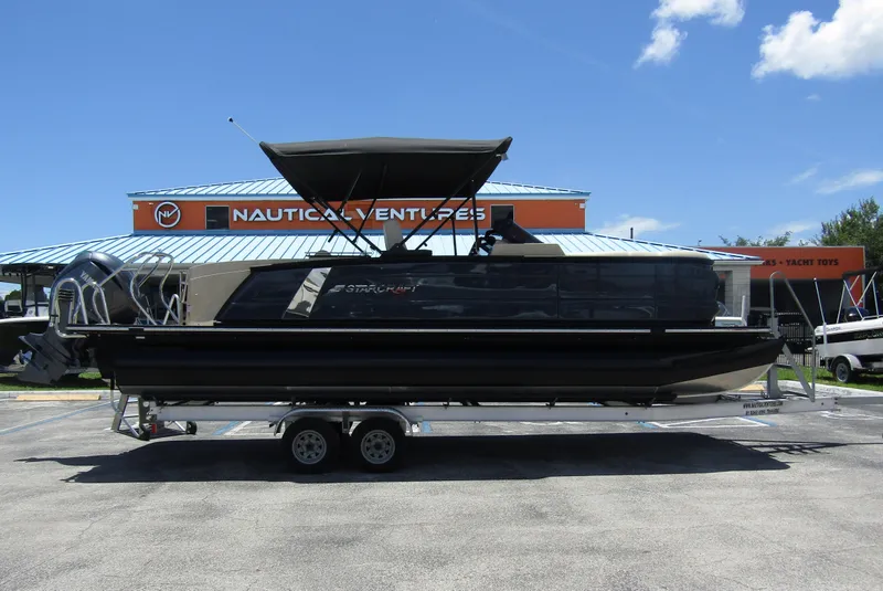 Slide: The Image of 2024 Starcraft RX 23 Q DC pontoon boat on a trailer at Nautical Ventures. - 4