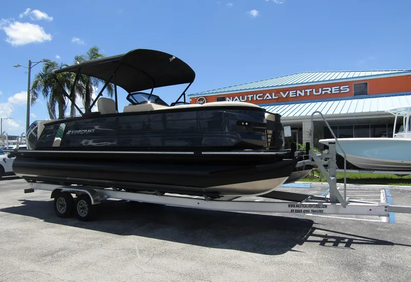 Slide: The Image of 2024 Starcraft RX 23 Q DC pontoon boat on a trailer at Nautical Ventures. - 5