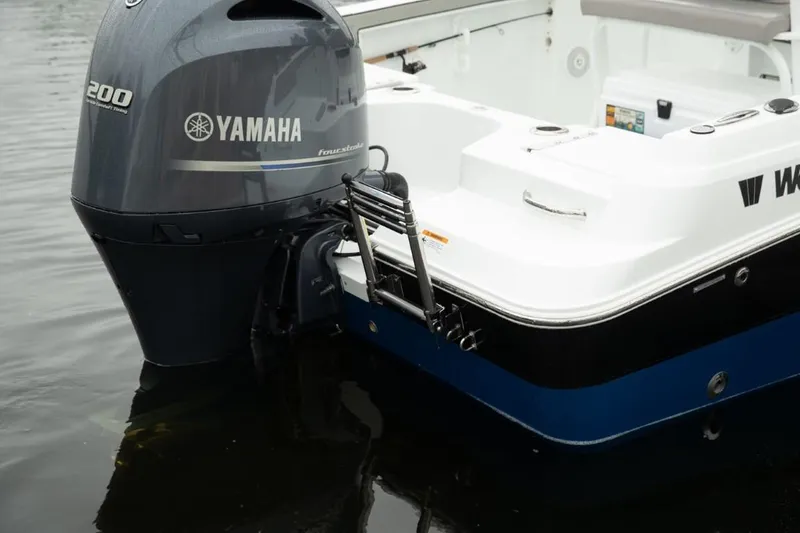 Slide: The Image of 2024 Wellcraft 202 Fisherman boat with Yamaha 200 engine in water. - 23