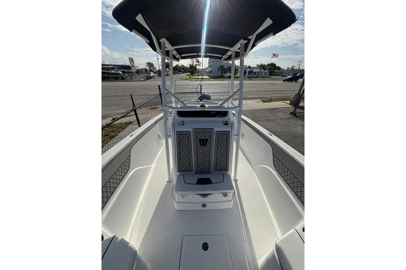 Slide: The Image of 2024 Wellcraft 202 Fisherman boat interior with T-top and spacious deck. - 3