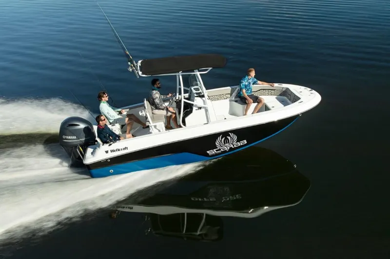 Slide: The Image of 2024 Wellcraft 202 Fisherman boat cruising on water with four passengers. - 8
